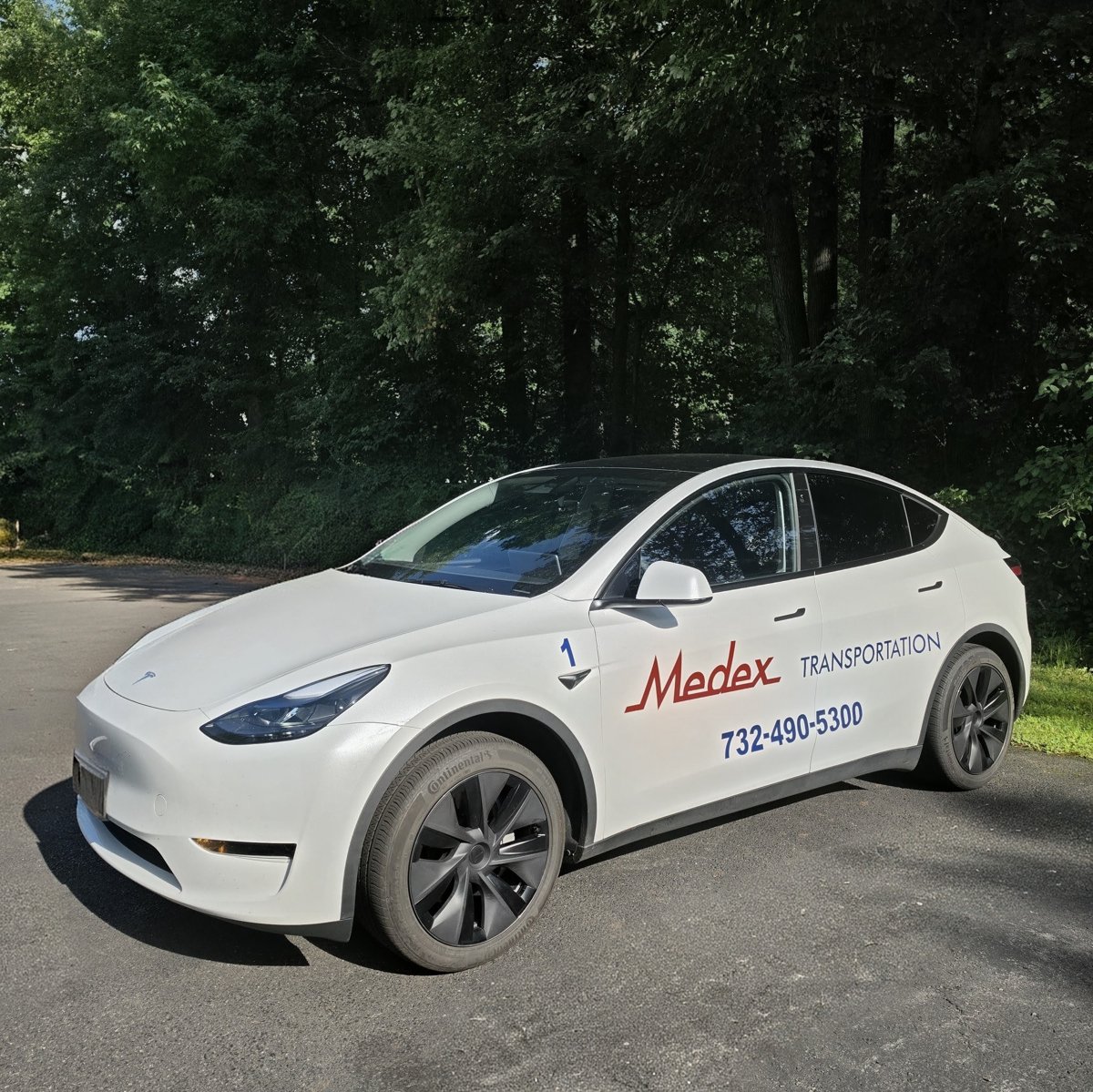 Medex Transportation white Tesla Model Y