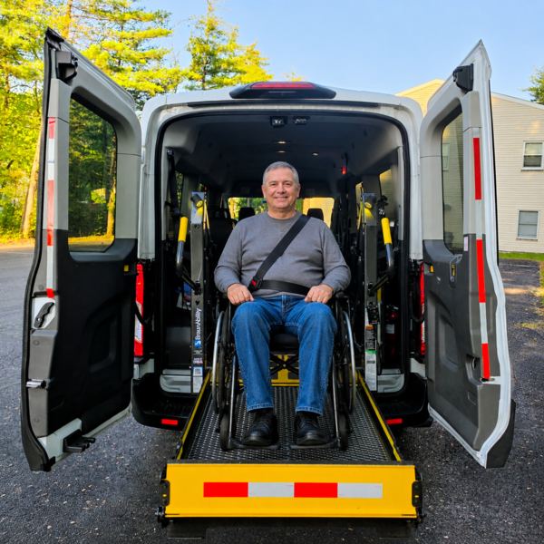 Medex MAVT assisting a rider on the wheelchair lift